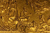 Luang Prabang, Laos - Wat Mai the gilded stucco engravings narrate the Vessantara Jataka, the penultimate rebirth as a human of the future Gotama Buddha. 